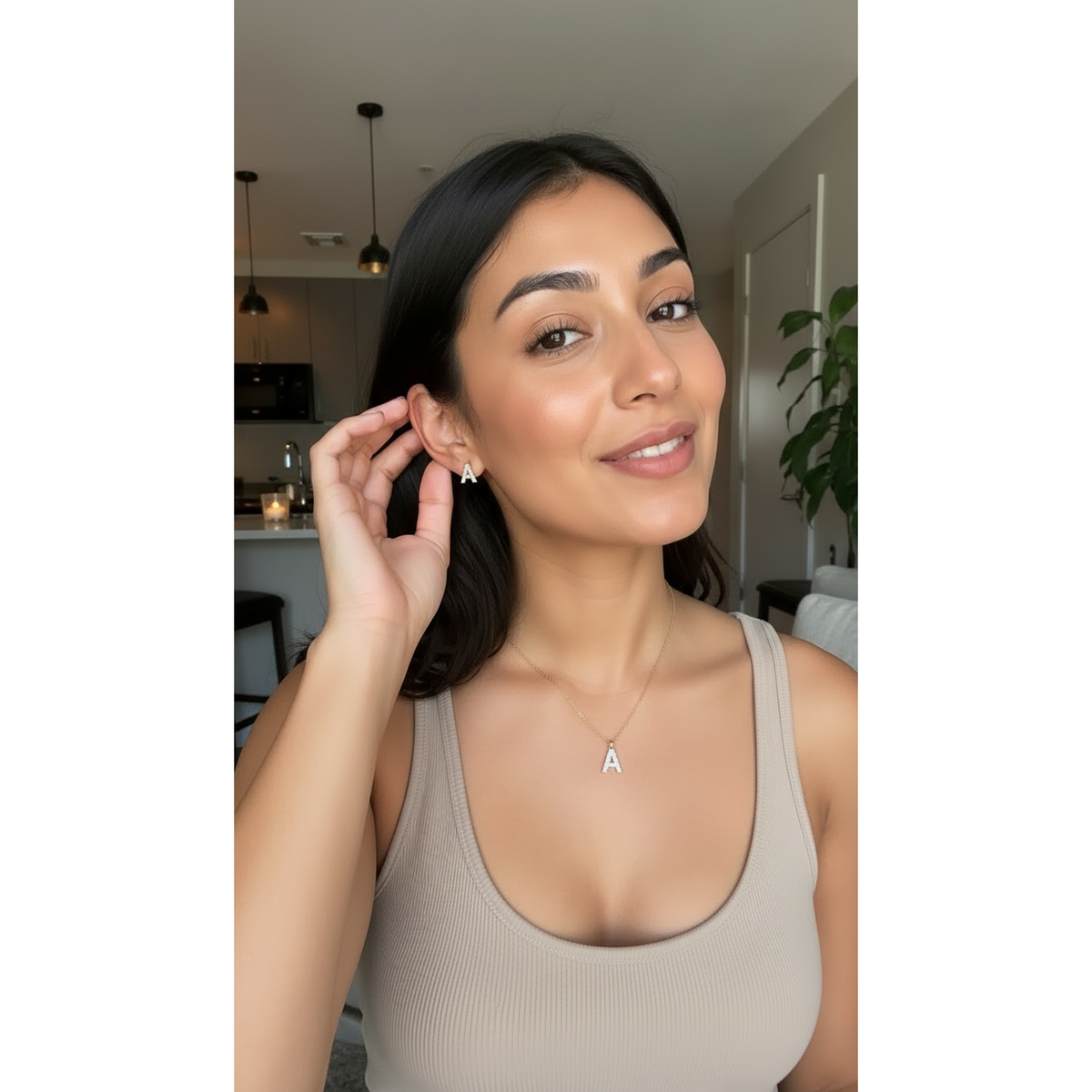 Woman wearing the Crystal Minimal Set — crystal-set initial A pendant with matching crystal A studs