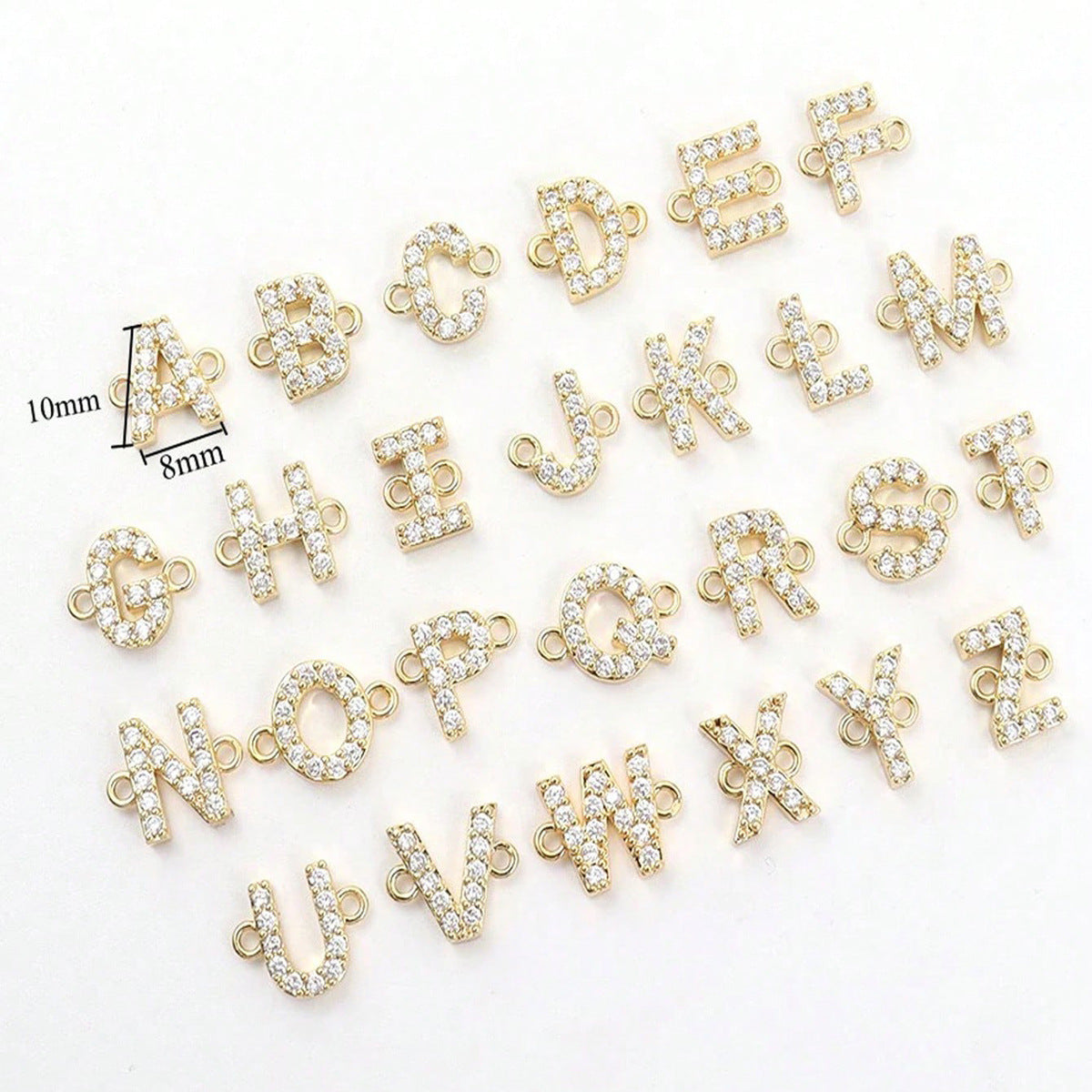 All 26 crystal-set gold initial charms A to Z, 10mm by 8mm