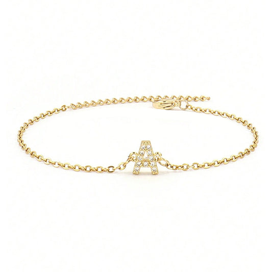 Crystal initial bracelet shown flat on a plain background