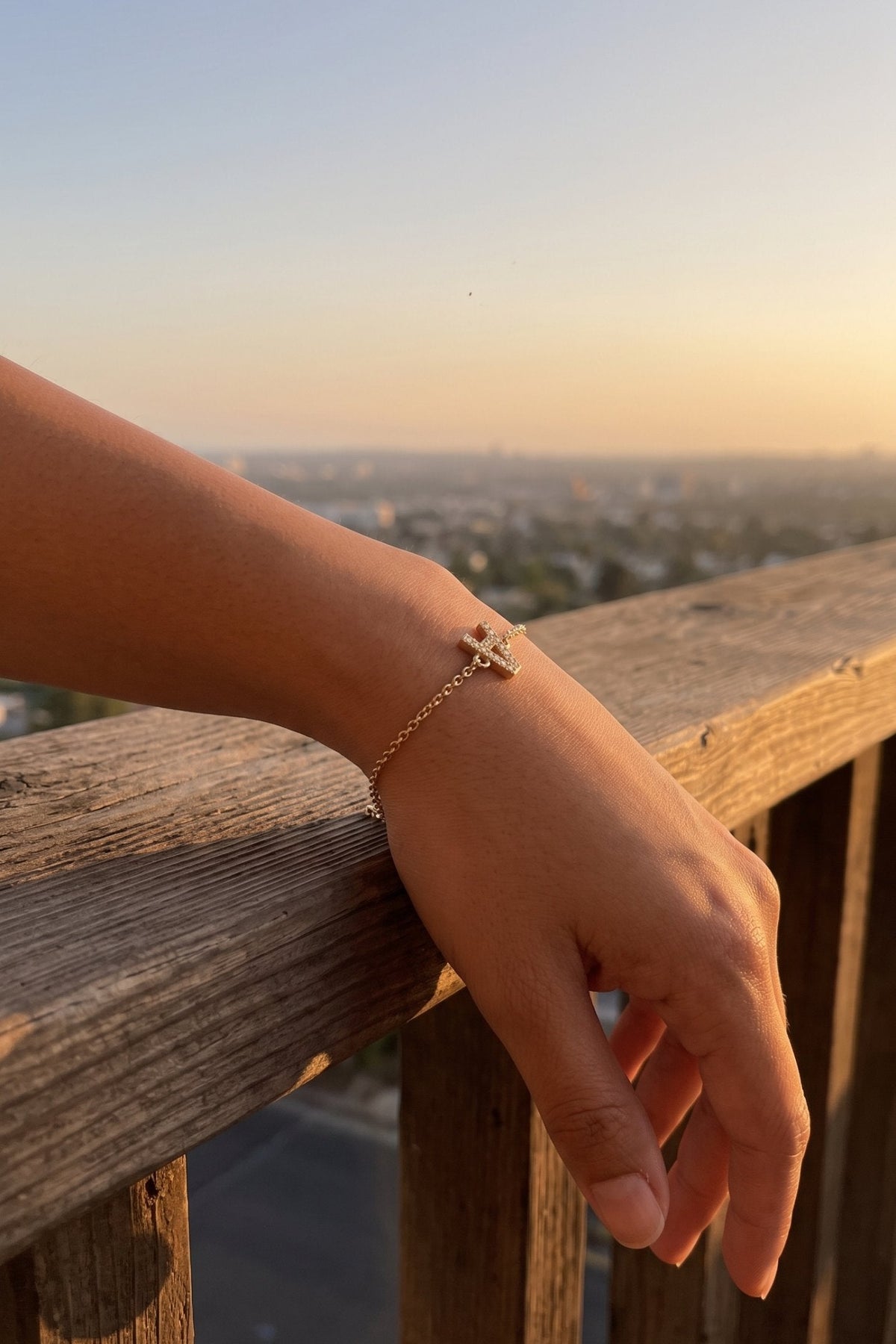 Crystal Initial Bracelet with letter A on a wrist at sunset — Pulse and Glow